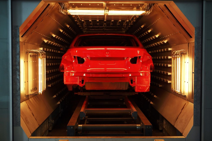 Continuous curing oven for brake pads